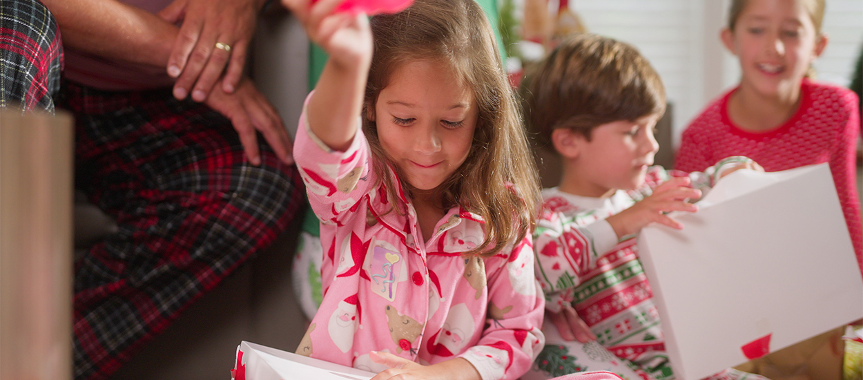 Girl opening gifts